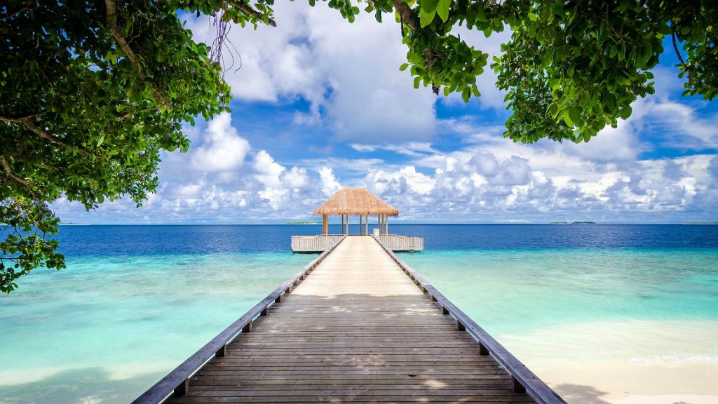 Amilla Maldives overwater walkway leading to yoga pavilion
