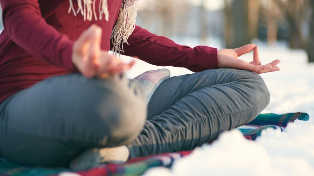 Close up of female meditating outdoors