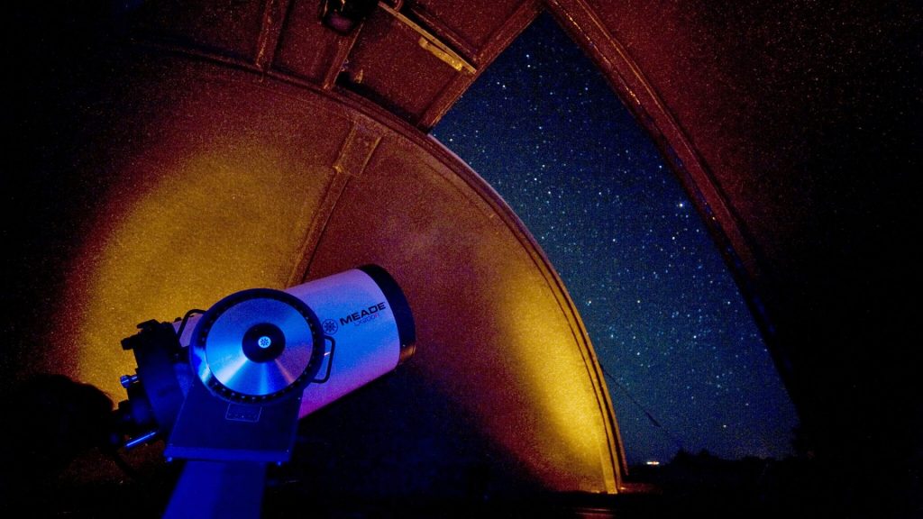 explora Atacama's observatory and telescope pointing towards the starry sky