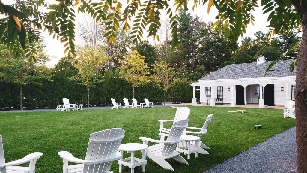 Kimpton Taconic Hotel's outdoor courtyard with white lounge chairs