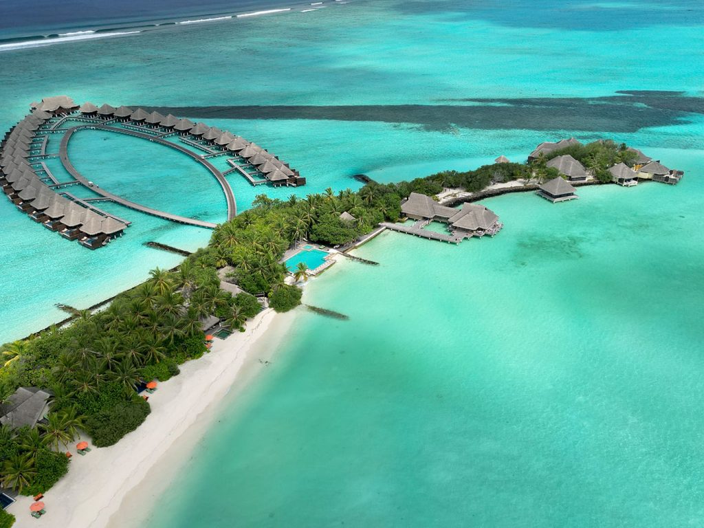 Taj Exotica Resort & Spa Maldives resort overwater villas and sandbank drone shot by Roxana Cozma of Wanderlust Voyager