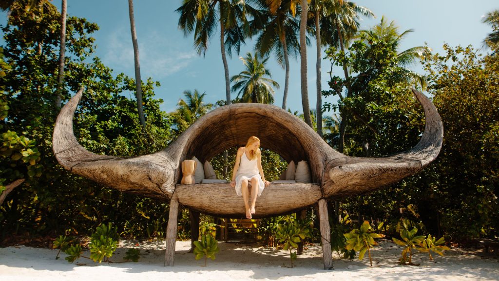 treehouse hotels - Woman sitting inside Joali, Maldive's Manta Treehouse