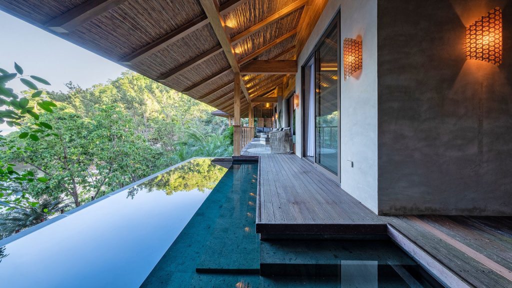 luxury hotel amenities - Scenic pool surrounded by nature at Manami Resort in the Philippines.