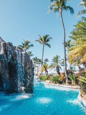 The magnificent pool at Grand Wailea, Maui, overlooking the Pacific Ocean, providing a serene and luxurious retreat for guests.