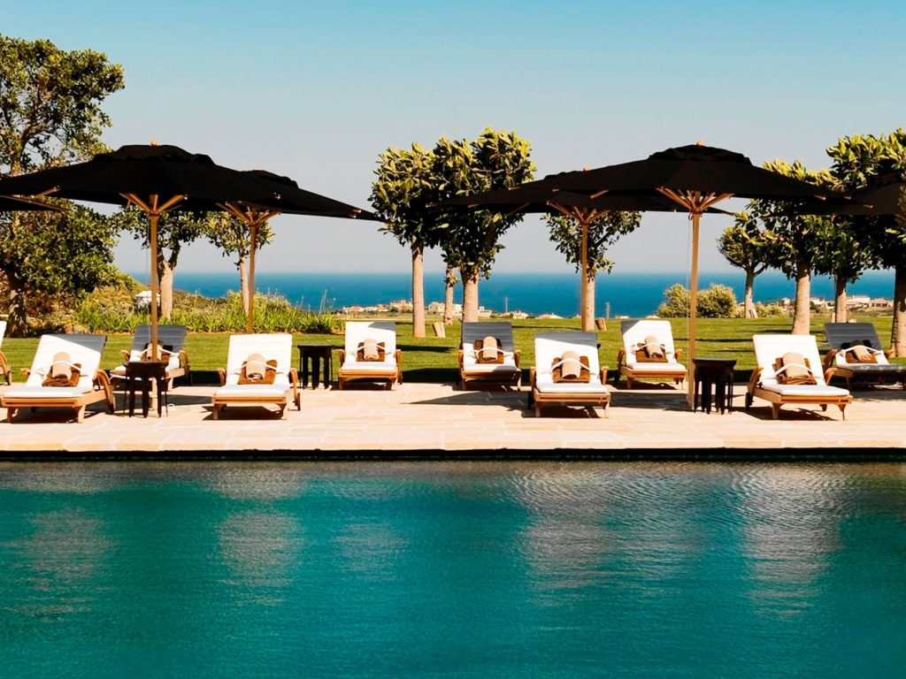 20 unforgettable stays - Finca Cortesin outdoor pool with loungers and umbrellas