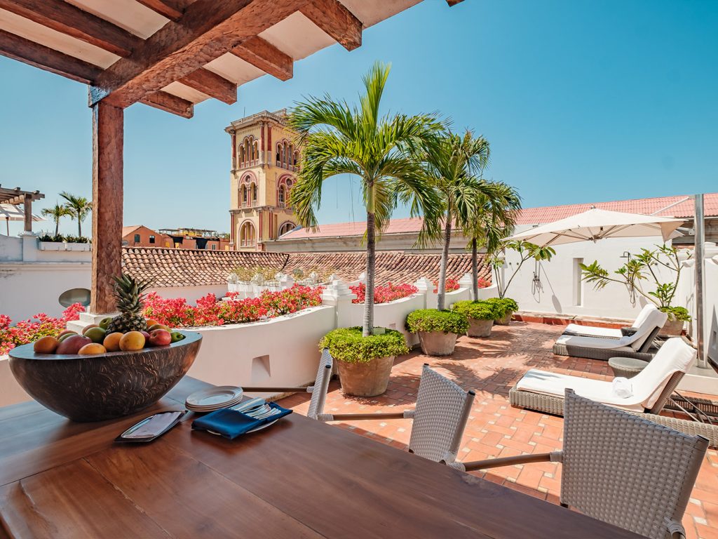 20 unforgettable stays - Casa San Agustin outdoor terrace with tables, plants and loungers