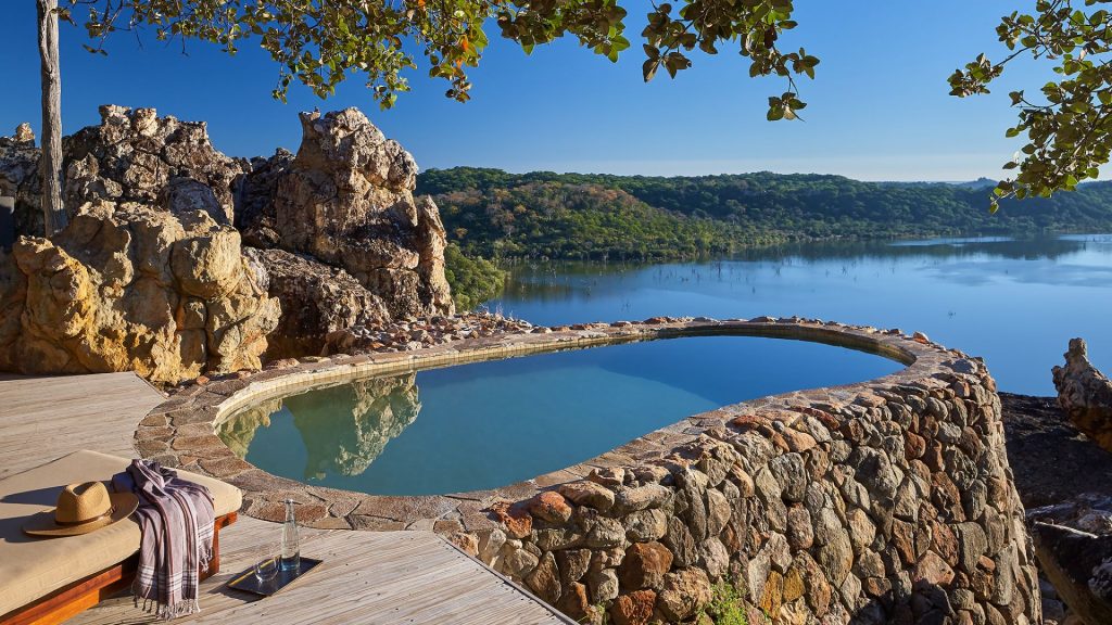 best romantic getaways - Singita Pamushana Lodge Pool Overlooking Lake