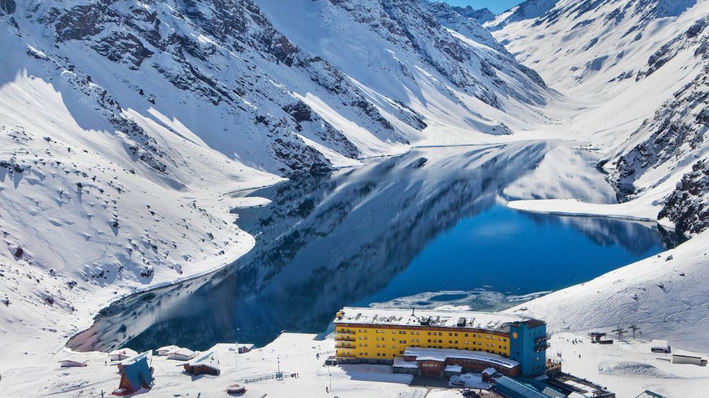coolest ski resorts - Hotel Ski Portillo in the snow next to a lake
