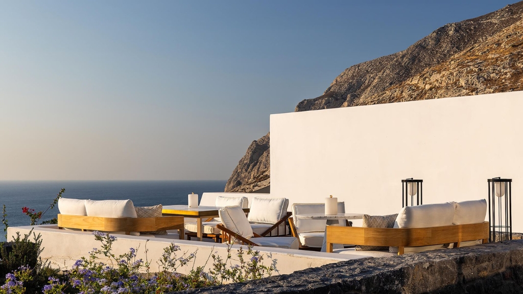 Best Greek Islands to Visit - Santorini - Sandblu - chairs at a resort overlooking the Aegean Sea