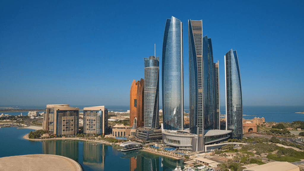 Skyscraper hotels - Conrad Abu Dhabi Etihad Towers, Abu Dhabi, UAE - a group of skyscrapers behind the Arabian Gulf
