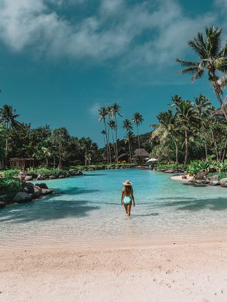 COMO Laucala Island Travel Diary by Jyo Shankar - woman standing in lagoon pool