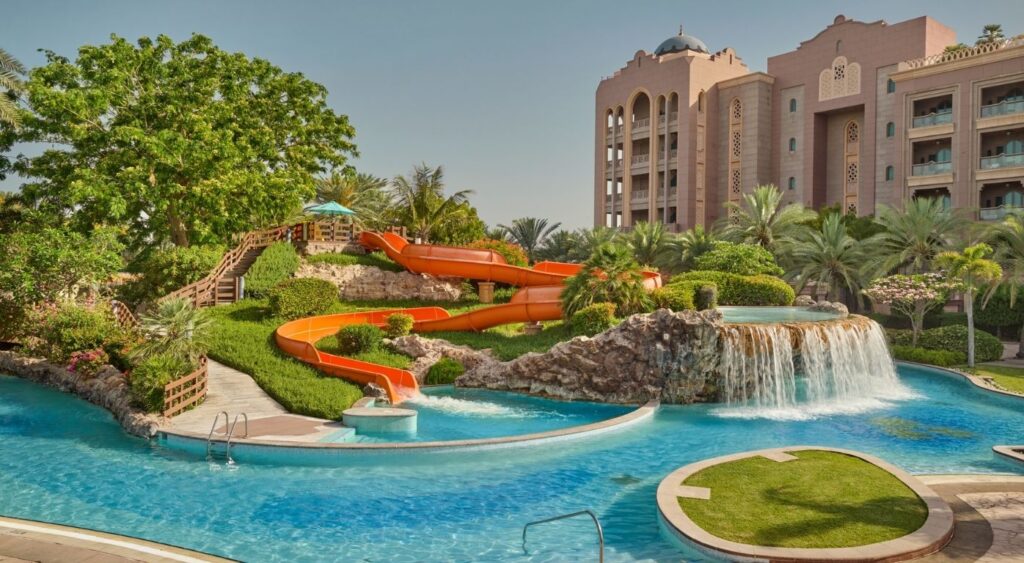 Best family hotels in Dubai - Emirates Palace Mandarin Oriental Abu Dhabi - Abu Dhabi, United Arab Emirates - Family pool with a water slide and waterfall