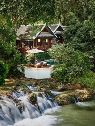 Best Places to Travel in 2026 featuring Luang Prabang, Laos and Rosewood Luang Prabang | a hotel villa room with a pool and a waterfall