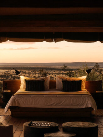 Best Places to Travel in 2026 featuring Namibia and Our Habitas Namibia | Hotel bed with a view of the landscape