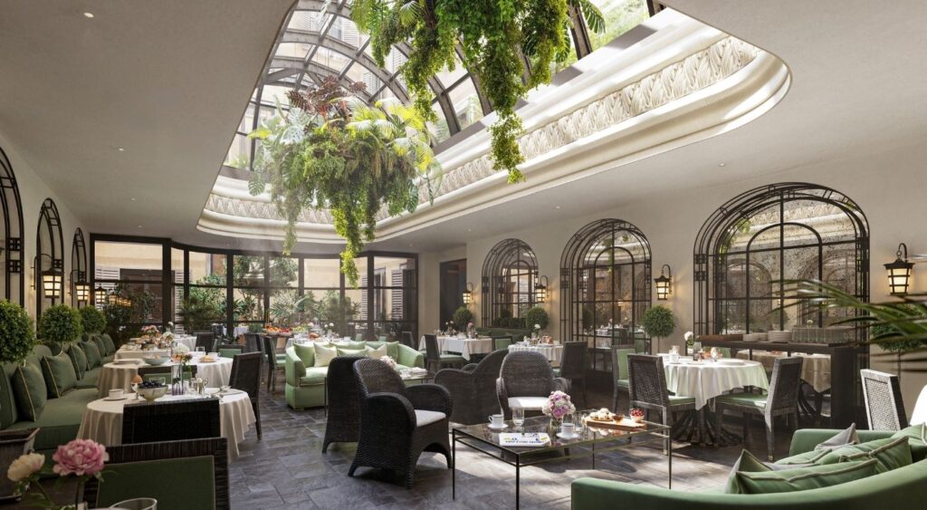 Luxury hotels in Milan - The Carlton Milan - Quadrilatero della Moda - A section of Cafe Floretta featuring the cafe's glass domed ceiling and greenery