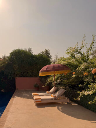 Family Trip to Morocco Travel Diary by Anna Cort | Lounge chairs and an umbrella at the private pool of The Royal Villa at The Oberoi, Marrakech