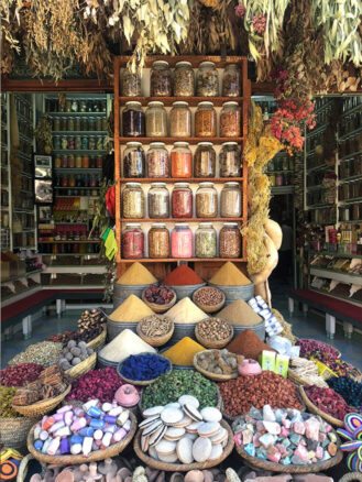 Family Trip to Morocco Travel Diary by Anna Cort | colorful spices at a stall at the medina in Marrakech