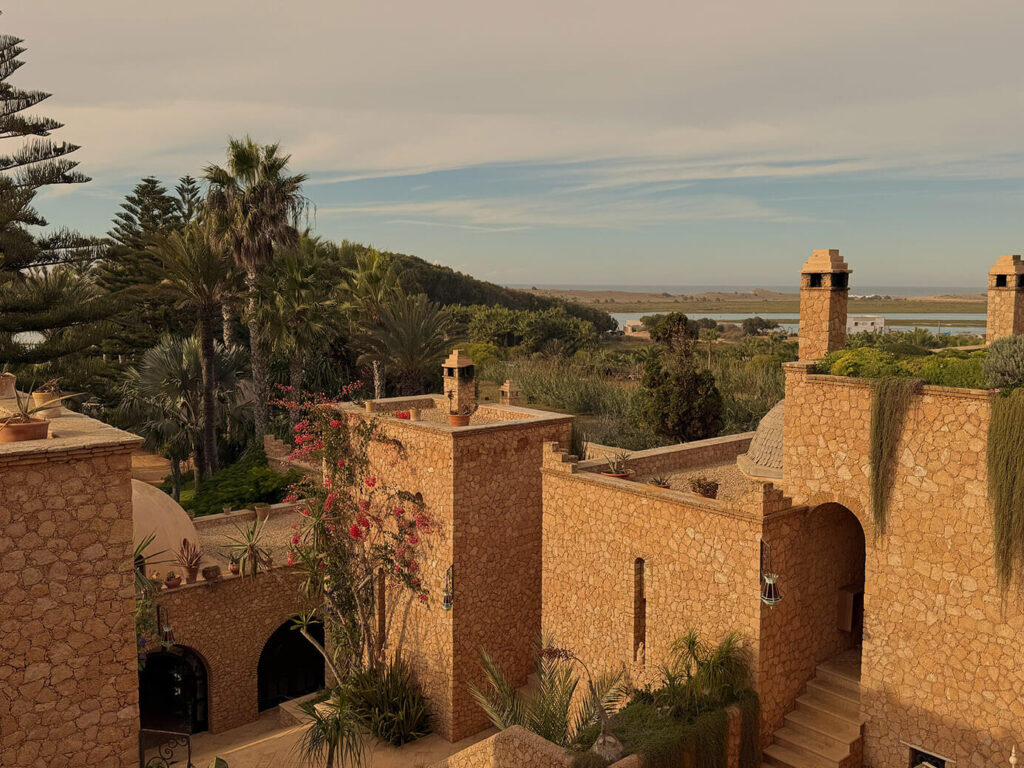 Family Trip to Morocco Travel Diary by Anna Cort | The beautiful facade of La Sultana Oualidia, Morocco with ocean views in the distance