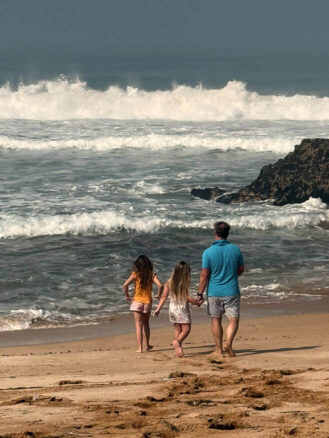Family Trip to Morocco Travel Diary by Anna Cort | a family walking on a beach at La Sultana Oualidia, Morocco
