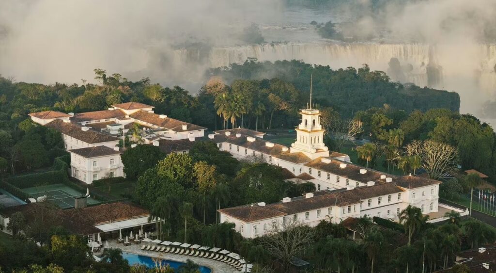 Exclusive experiences - Hotel das Cataratas, A Belmond Hotel, Iguassu Falls - Iguassu Falls, Brazil - Aerial view of the hotel with the falls in the back